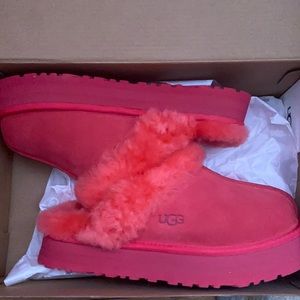 These beautiful pink UGG slippers have never been worn!